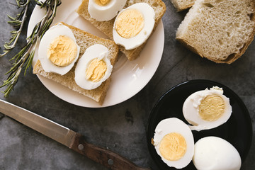 Top view boiled eggs and toast breakfast