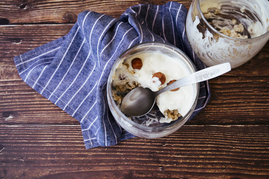 Healthy yogurt and oats breakfast on wooden table