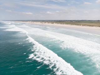 Aerial photography of the French beach of "La torche", surf spot. Summer.