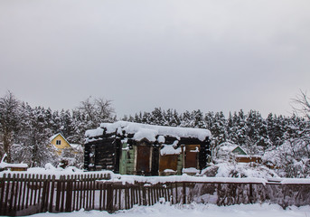 Burnt house in a village in winter