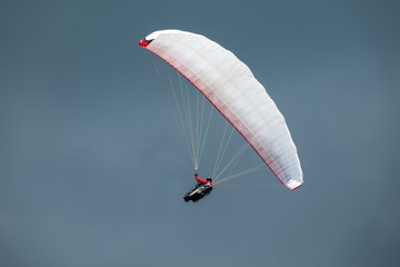 Paraglider in flight with the sky in background