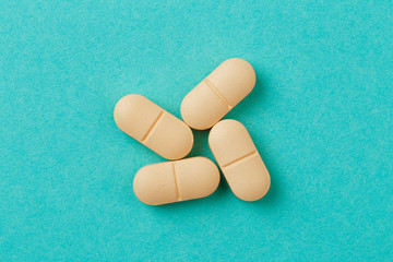 yellow tablets  on blue  background.