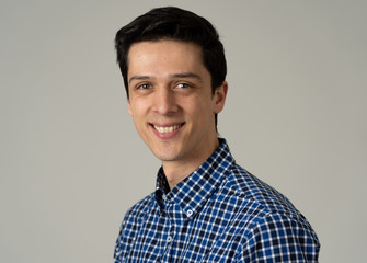 Portrait of young handsome man with happy and smiling face. Beauty concept and lifestyle