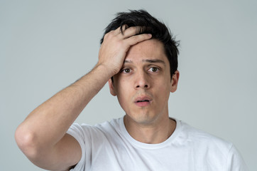 Portrait of sad and depressed man. Isolated on neutral background. Human expressions and emotions