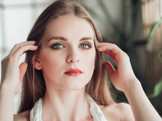 Portrait of beautiful balerina woman weared in white dress. Studio shot, natural light  © Olena Tkachenko