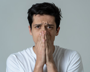 Portrait of sad and depressed man. Isolated on neutral background. Human expressions and emotions