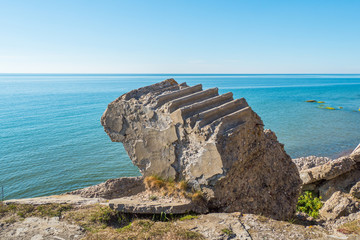 Fragment of a concrete staircase. Ruins of bunkers on the beach of the Baltic sea in Liepaja,...
