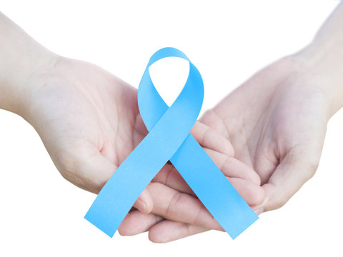 Men's Health and National Prostate Cancer Awareness Month in September and November as Mobember in hands isolated on white background.