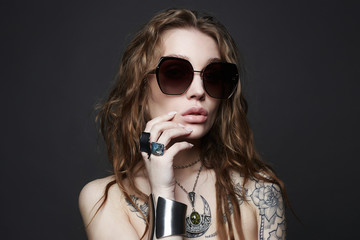 fashion portrait of Beautiful sexy woman with tattoo