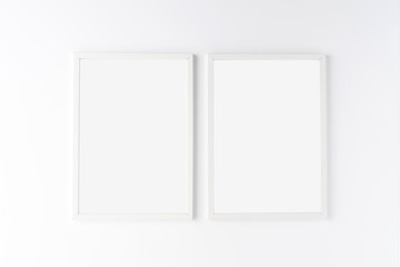 Two white photo frames with copyspace isolated on white background