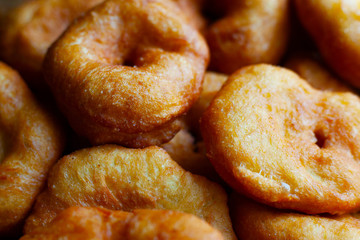 golden sweet donuts fried in sunflower oil,harmful street food fast cooking