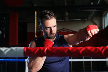 Sporty man in boxing ring