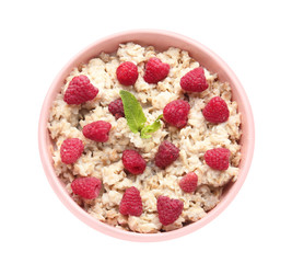 Bowl with tasty sweet oatmeal on white background