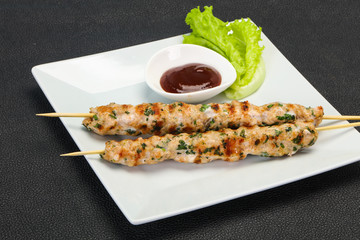 Minced pork skewer kebab with sauce