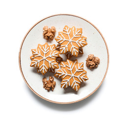 Obraz na płótnie Canvas Plate with tasty Christmas cookies on white background