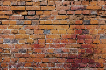 Beautiful horizontal texture of part of a old crashed brick gray wall is on the photo