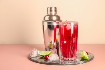 Composition with fresh cherry cocktail and shaker on table