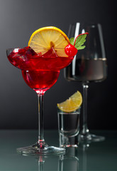 Various alcoholic drinks on a black background.