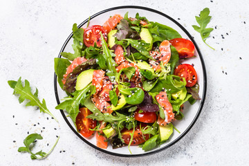 Salmon salad on white top view.