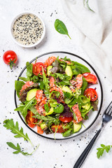 Salmon salad on white top view.