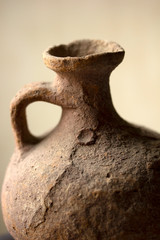 antique, earthen water pot, on color background