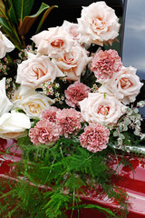A bouquet of beautiful roses, carnations, asparagus and gypsophilas at the spring festival