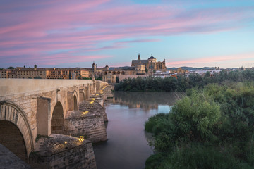 Cordoba skyline at sunrise with Old Roman Bridge and Mosque Cathedral - Cordoba, Andalusia, Spain