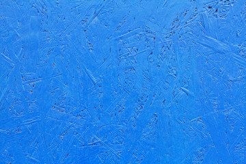 Blue painted OSB board as background, texture