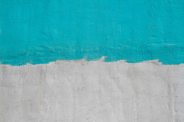 Colorful (gray and turquoise ) concrete wall as background, texture