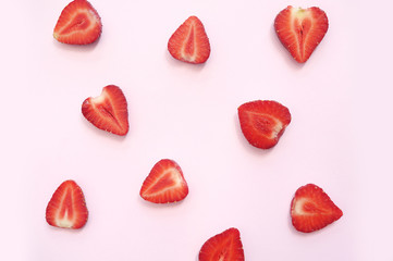 Strawberry slice red background texture. Top view. Concept of summer eco food