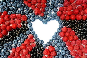 Summer blueberry, raspberries and currant heart frame detox isolated on white background. Love berries border design. Close up top view or flat lay with place for your text