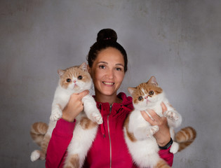 girl with two fluffy cats