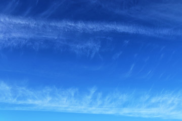 Beautiful and calming cirrus cloud formations on a deep blue summer sky