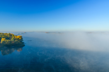 Fog over the water on a river Dnieper on autumn