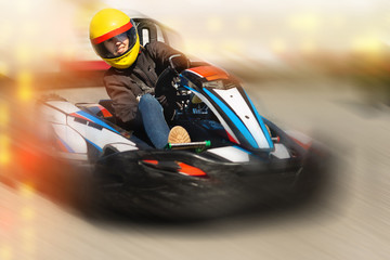 Girl driving kart at racing track outdoors - obrazy, fototapety, plakaty