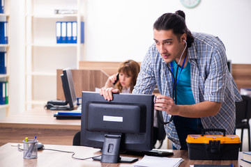 Young male it specialist in the office