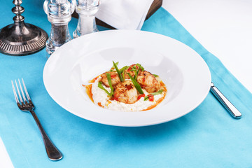  Mediterranean fish on a mashed potato pillow with tomato sauce
