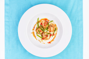  Mediterranean fish on a mashed potato pillow with tomato sauce