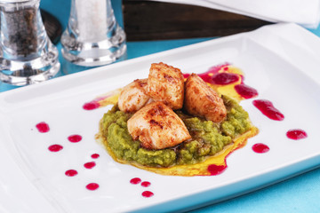  Mediterranean Chicken, on a pillow of pea puree with cranberry sauce