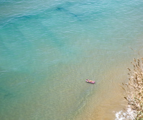Aerial view of the ocean. Turquoise sea water seen from above.