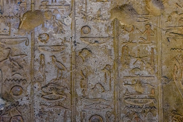 Egyptian ancient hieroglyphs on the stone wall