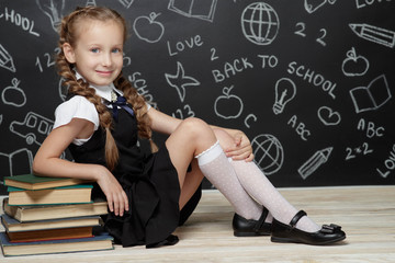 School fashion. Girl child in school uniform.