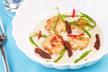 Mediterranean soup with seafood, crab meat, fish and chicken with creamy broth