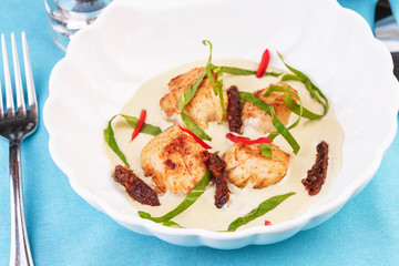 Mediterranean soup with seafood, crab meat, fish and chicken with creamy broth