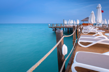Beautiful scenery with wooden pier on Turkish Riviera at sunset, Side
