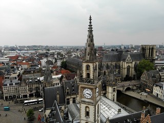 Obraz premium Amazing view from above. Small and comfortable town Gent. Medieval history around you.Must see for all explorer. View from Drone. From Belgium with Love. Clock tower.
