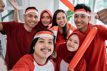 Fototapeta premium happy asian people celebrating indonesia independence day taking selfie