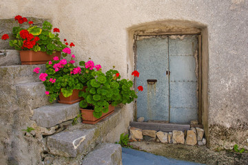 Fototapeta na wymiar A metal door in the small historic hill village of Clabuzzaro in Friuli-Venezia Giulia, north east Italy