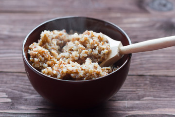 bowl of hot buckwheat porridge on the village table