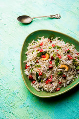 Dapde Pohe is a typical Maharashtrian breakfast, made with thin variety of poha and fresh coconut with chilli, peanuts and nuts. served in a bowl or plate. selective focus